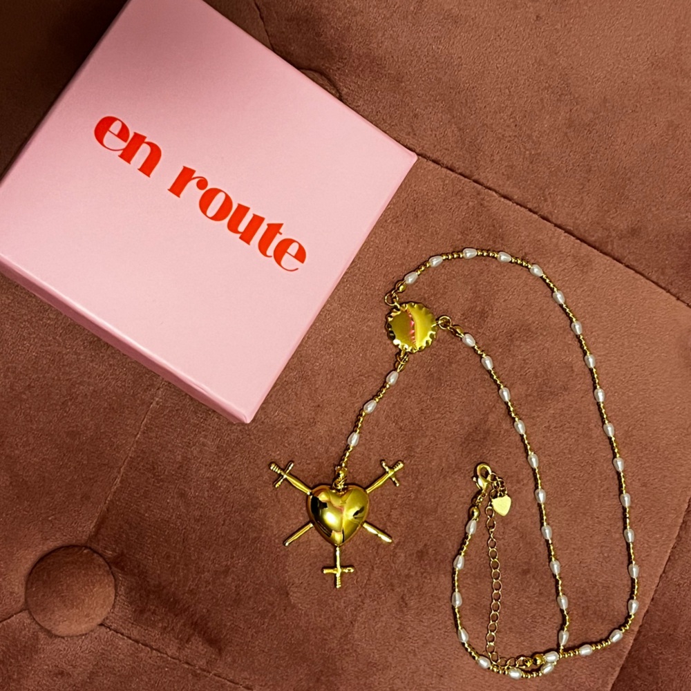 En Route heart sword necklace
